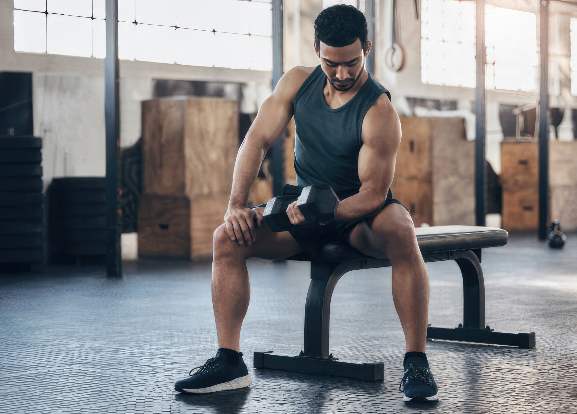 A Man doing weight training basics: Biceps Curl