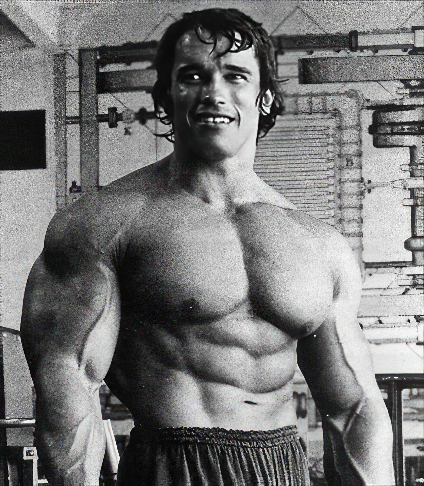 Arnold Schwarzenegger, standing relaxed and confident